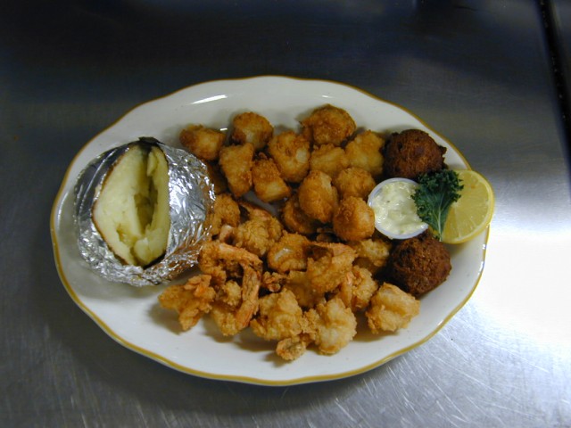 Combination: Fried Fantail Shrimp and Fried Scallops with Baked Potato. Salad Bar included of Captain Joe's Seafood, Brunswick, Georgia